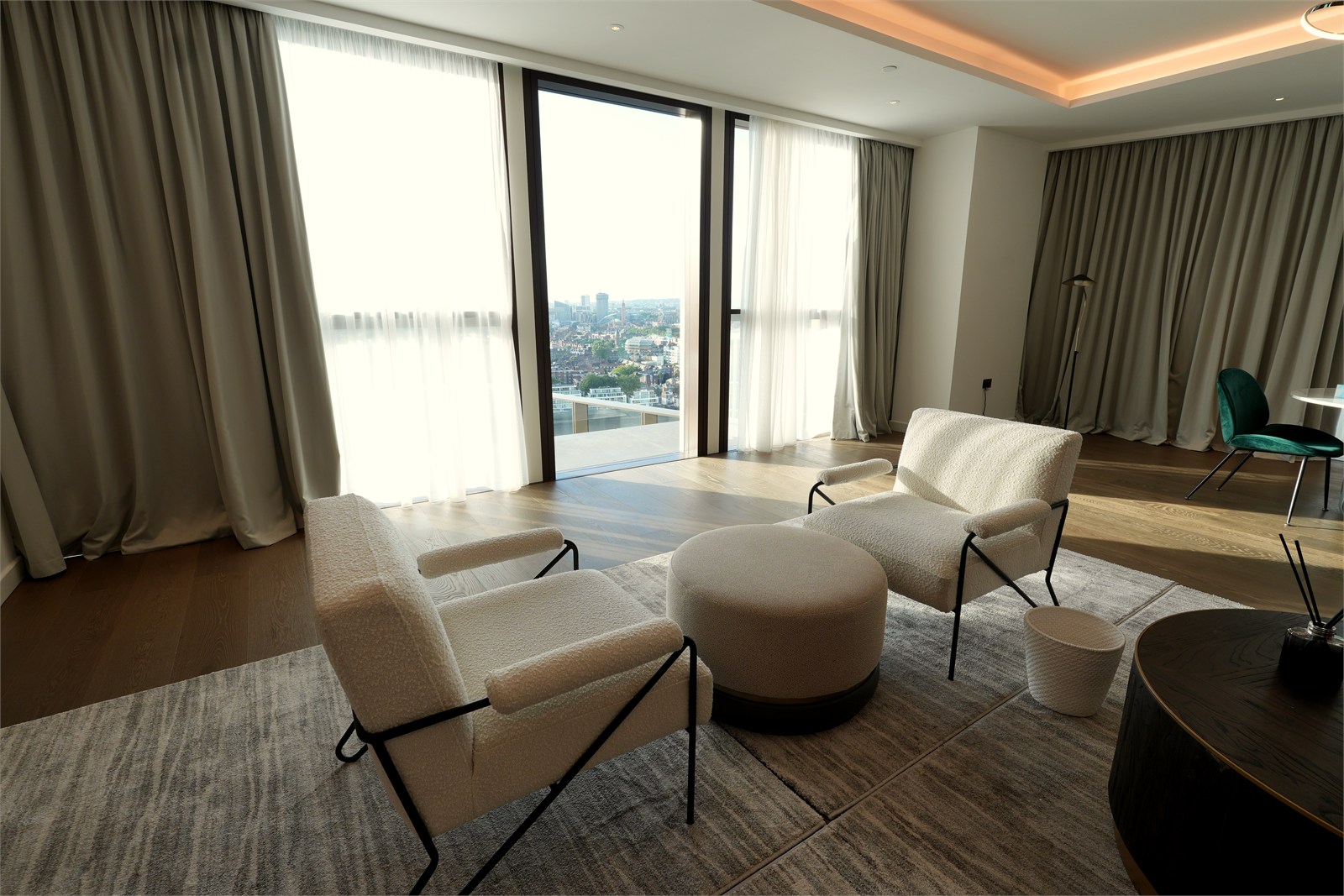 Thames City living area with finished flooring, curtains and city-facing glazing
